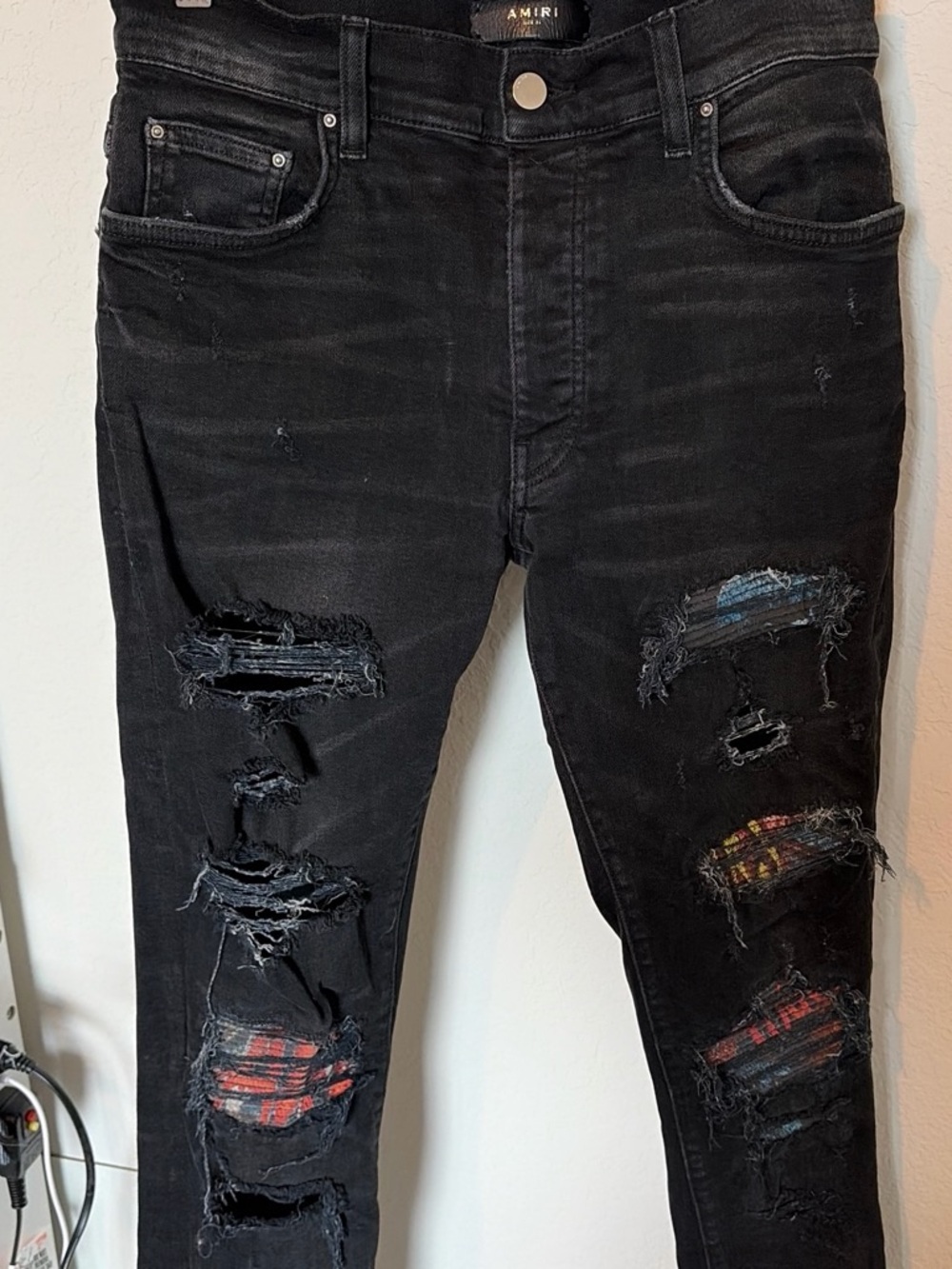 AMIRI Black Distressed Skinny Jeans with Plaid Patches